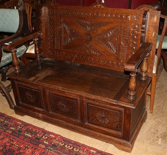 Carved oak monks bench